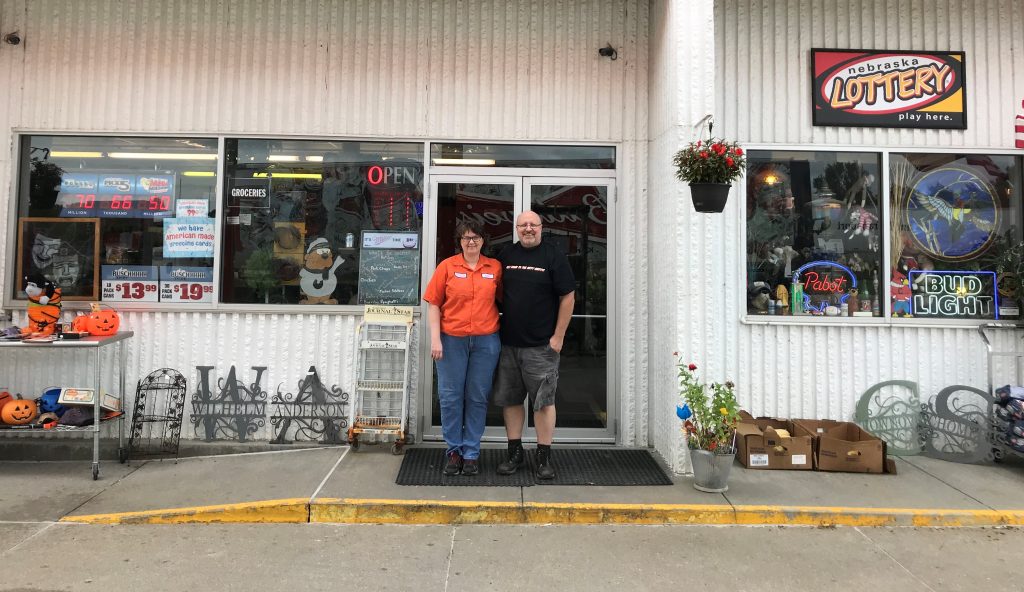 Bev and Dan Anderson stand in the doorway of Nitty Gritty Thrift and Gas in Unadilla.