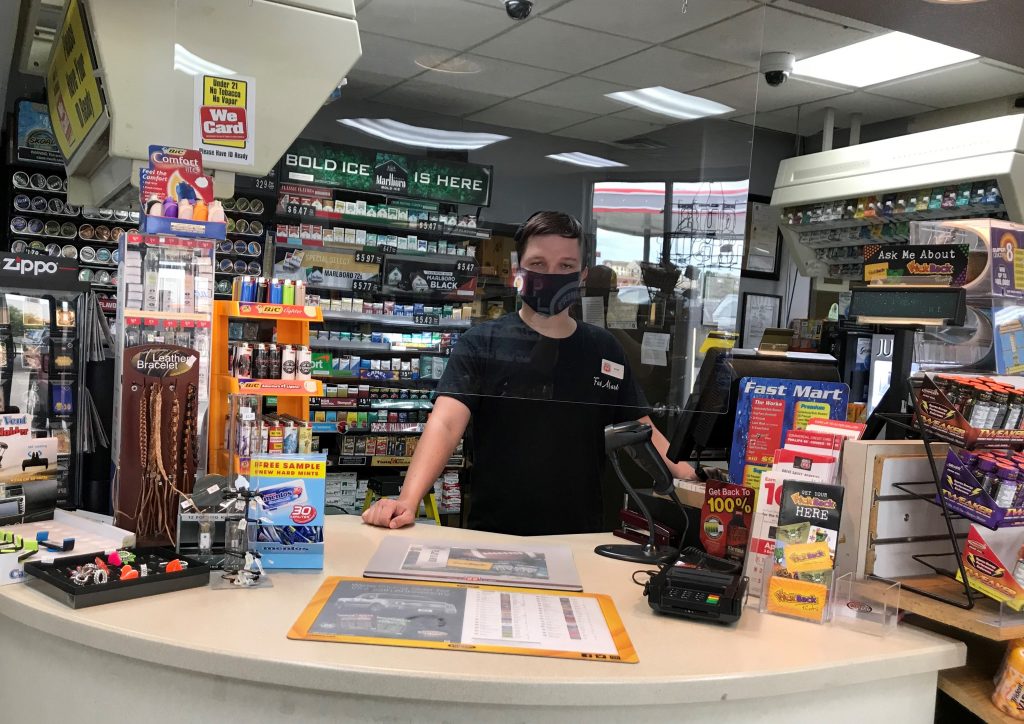 Rush Boehr, who sold the $1 million winning ticket, works behind the counter at Fast Mart in Lincoln.