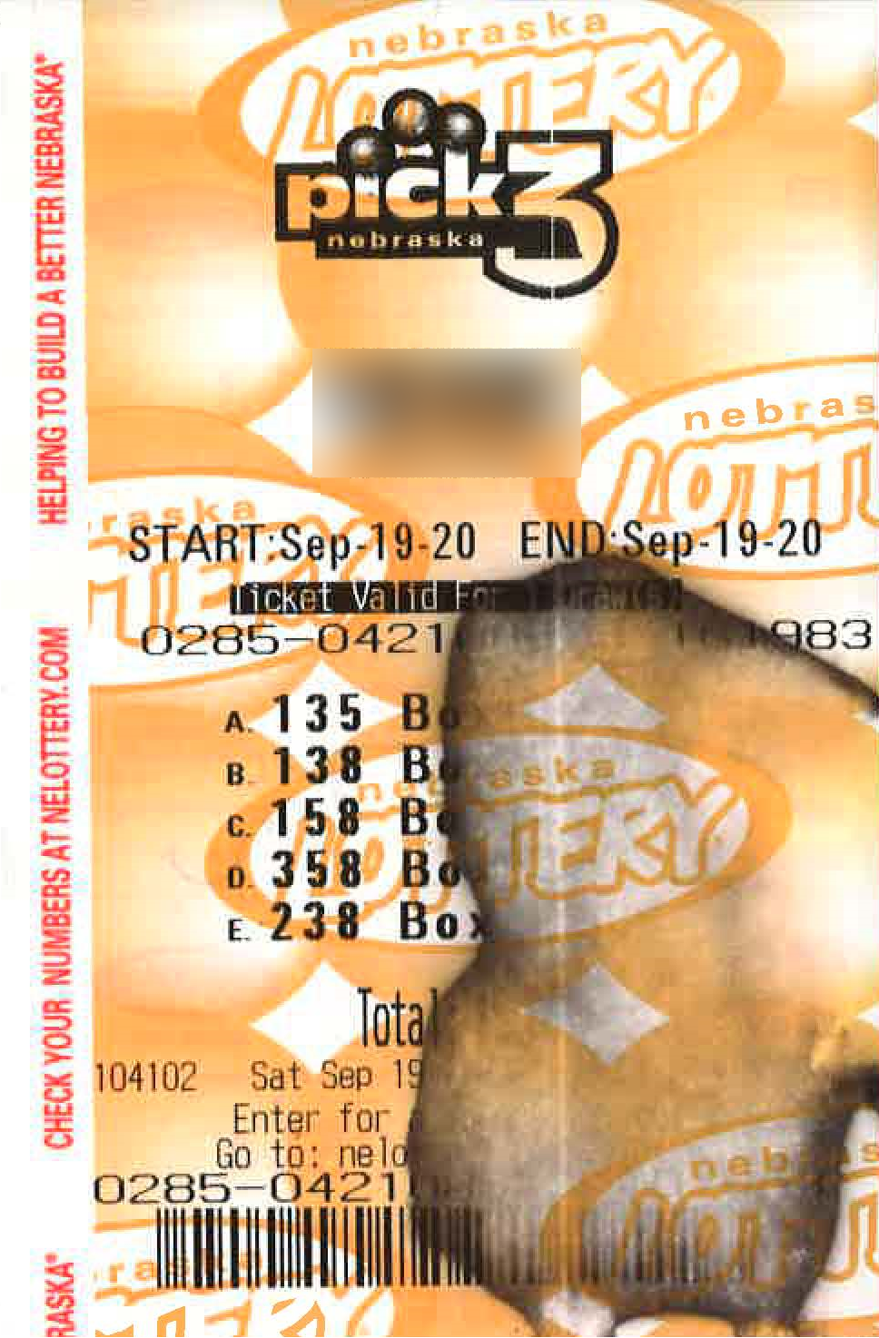 A Nebraska Pick 3 ticket damaged by hand sanitizer. 