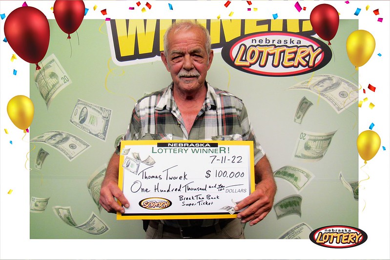 Tom Tworek of Columbus with a big check following his latest $100,000 win.