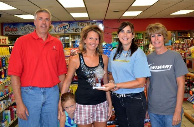 Mike and Sara Gokie receive an award for being a top Nebraska Lottery retailer in 2013.